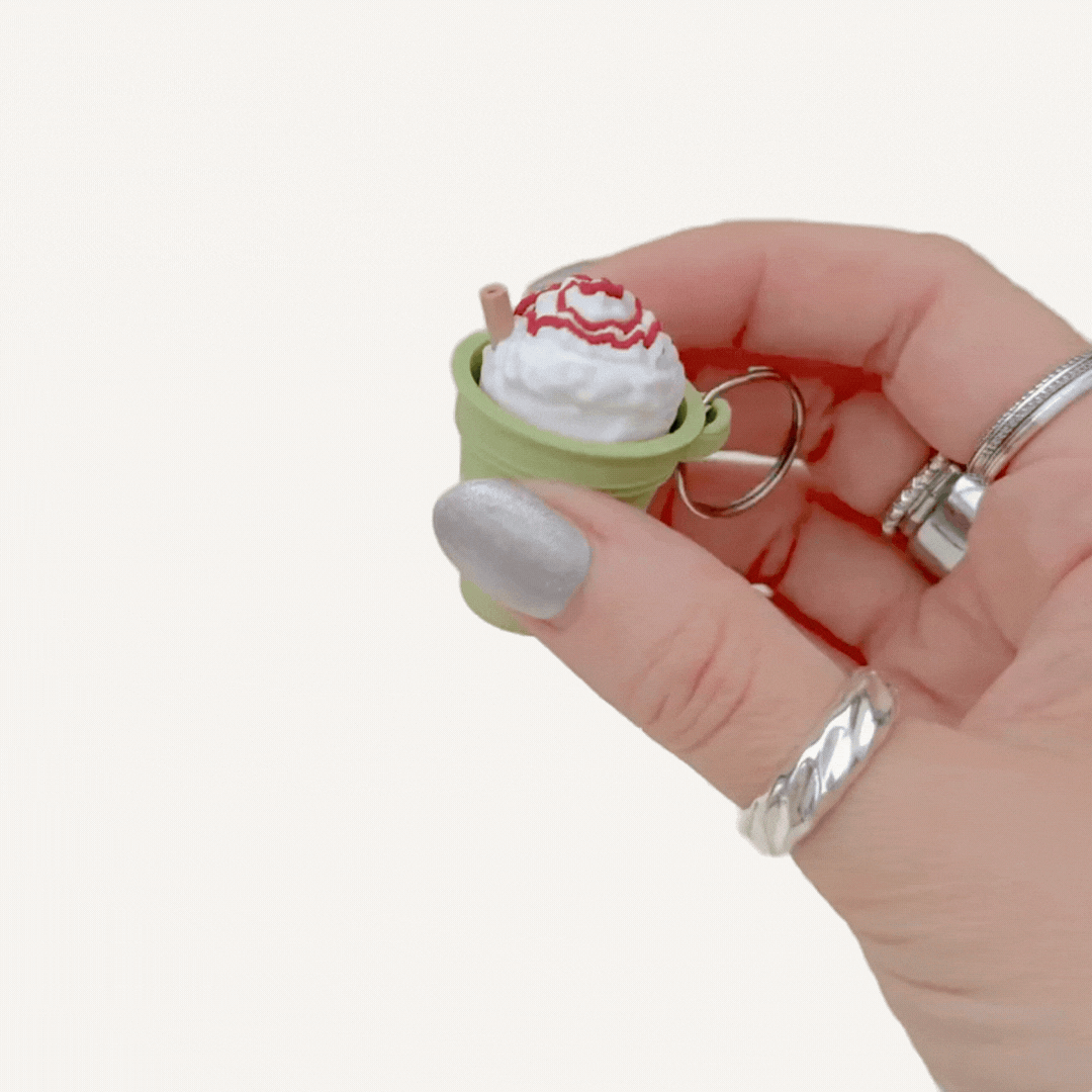 Clip-on sensory clicker with realistic drink design, tactile textures and optional quiet click.
