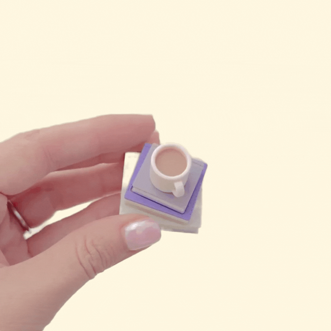 Compact book stack clicker for sensory fidgeting; press the cup to click; optional quiet click; desk-friendly and portable.
