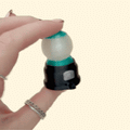Mini gumball machine clicker fidget with press-down top, satisfying tactile input, choose Click or Quiet Click.
