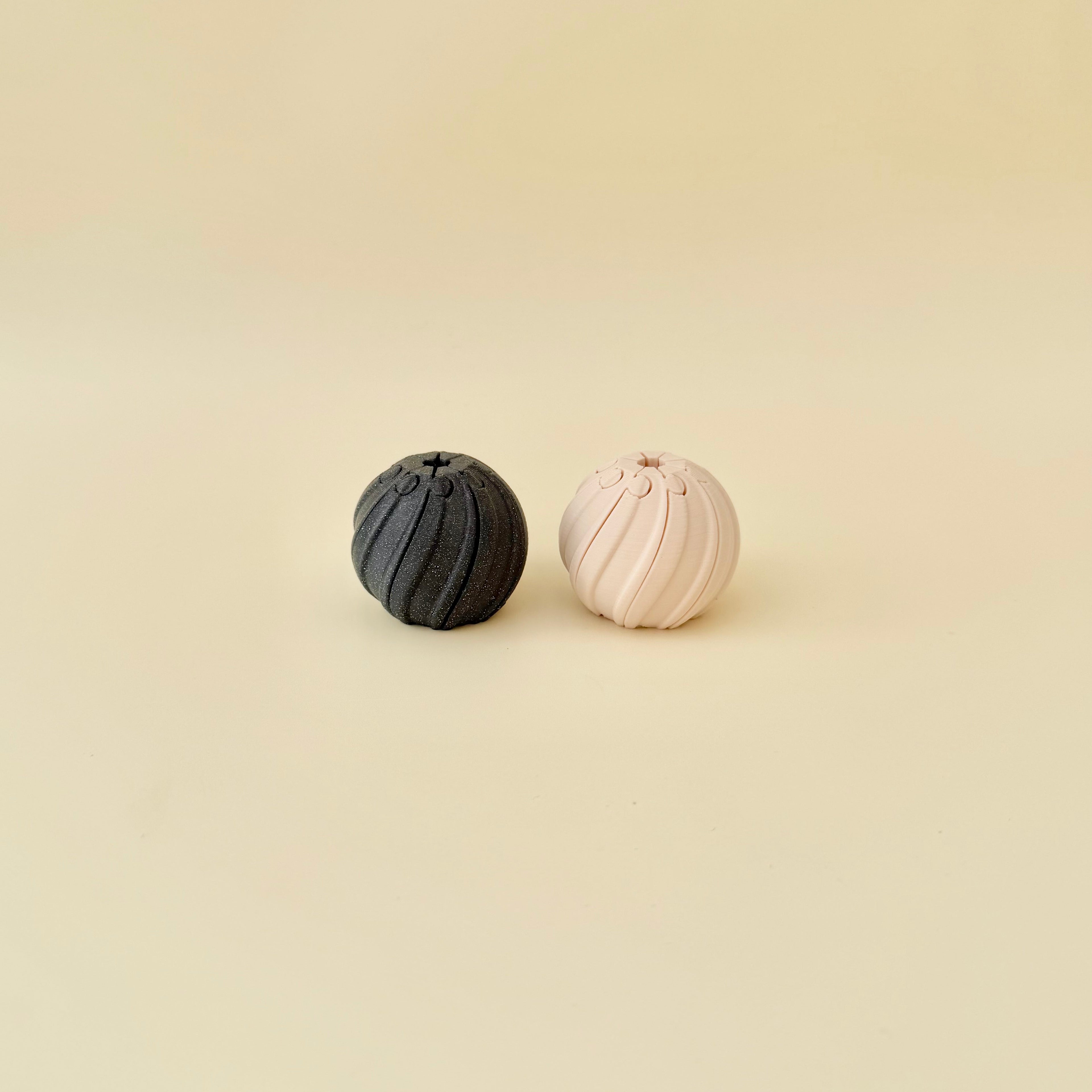 Small textured twist fidget with spiral grooves that provide tactile feedback and repetitive motion.
