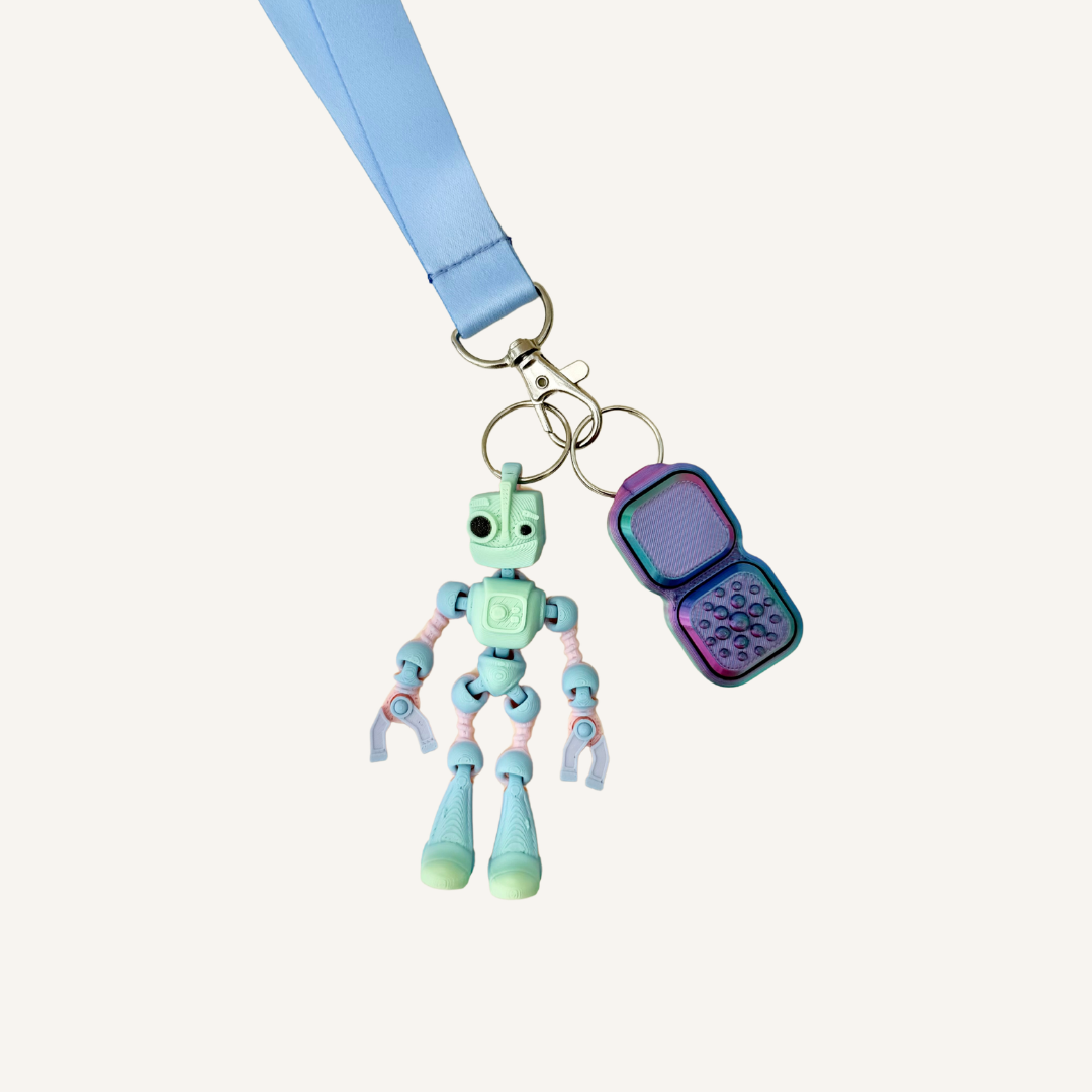 Small robot sensory fidget for lanyards, bags and keys with wiggly movement and tactile feedback.