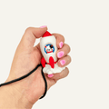 Cute rocket cat sensory clicker with wrist strap, pressable feedback and portable fidget use.