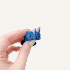 Small articulated slug-style fidget with tactile detail and flexible body for calming and focus.
