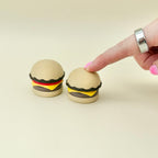 Burger-shaped sensory clicker for repetitive pressing, focus support and neurodivergent-friendly fidgeting.