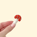 A small, interactive fidget toy with a moving top.