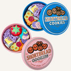 Retro tin-style clicker fidget with a working lid and textured mini sewing pieces inside for tactile play.
