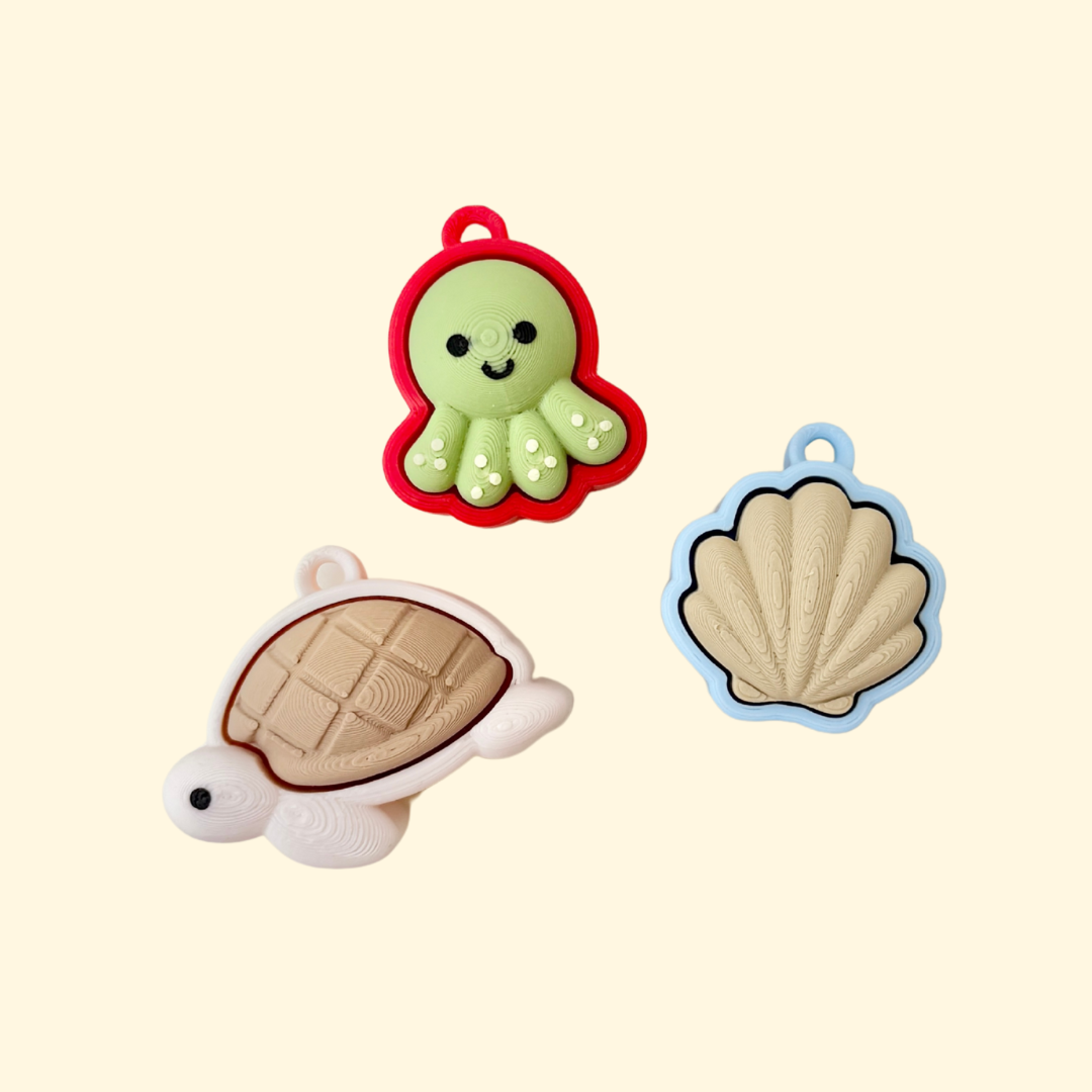 textured clicker with a ridged top and loop for keychain fidgeting
