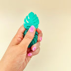 Shimmer green monstera fidget with smooth flip motion for focus, tactile input and busy hands.