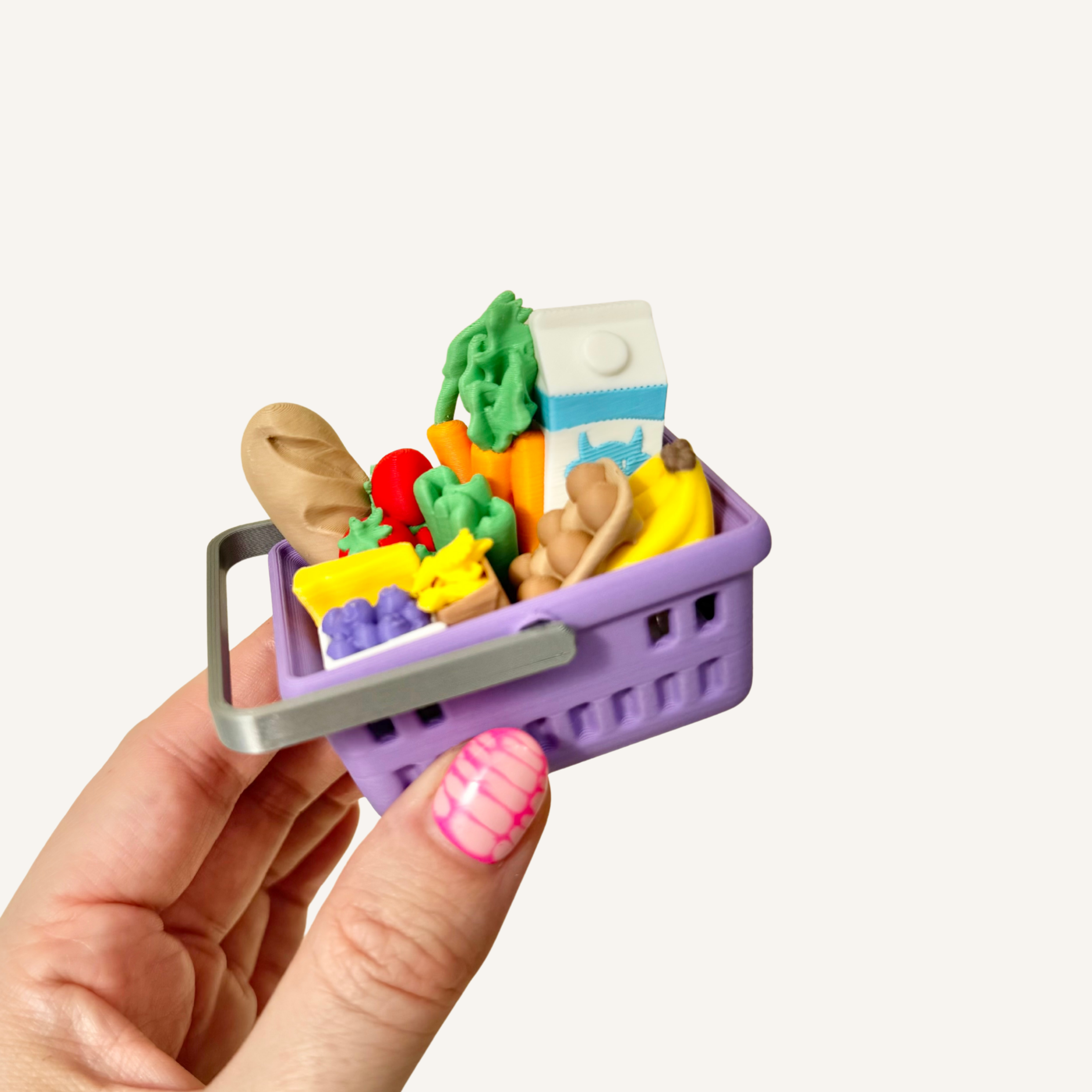 Mini shopping basket with four hidden clickers, realistic groceries and tactile details.