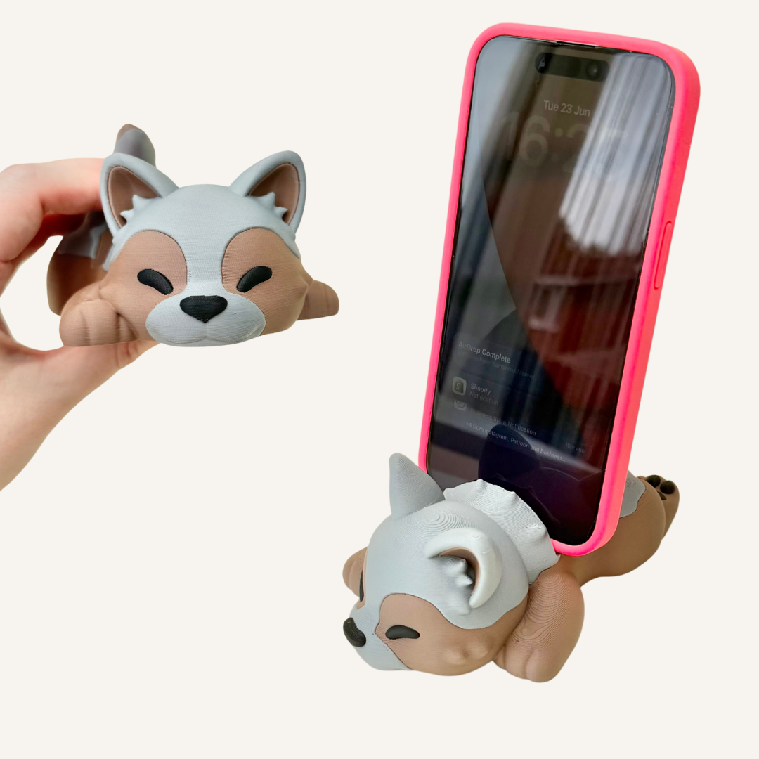 Cute 3D printed puppy phone stand for desks, bedside tables and sensory-friendly workspace setups.