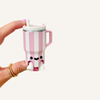 Chunky tumbler cup sensory clicker with straw, handle and tactile details for busy hands and focus support.