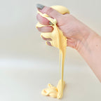 Soft sensory putty in a travel tin with a smooth buttery feel for stretching, squishing and quiet tactile play.
