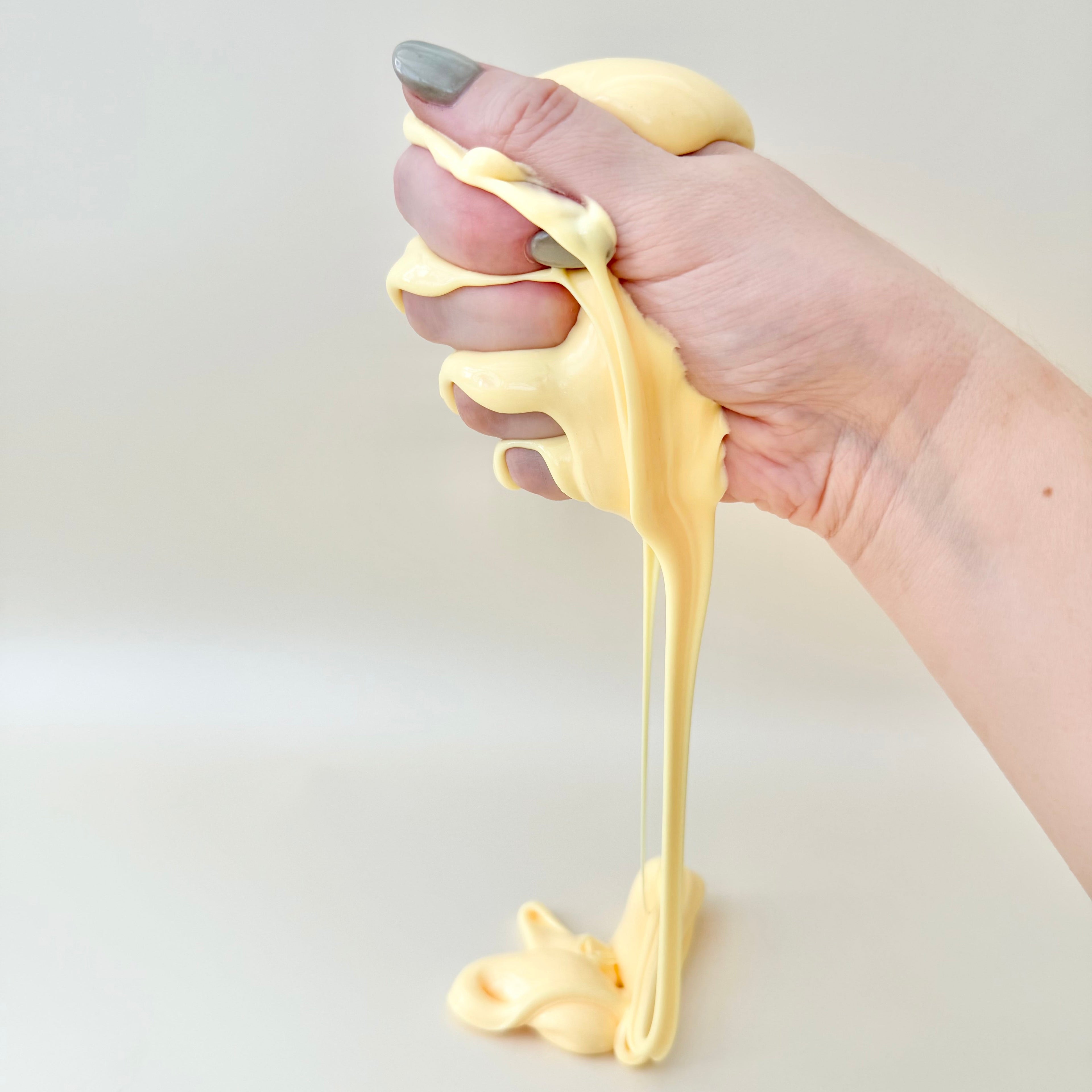 Soft sensory putty in a travel tin with a smooth buttery feel for stretching, squishing and quiet tactile play.
