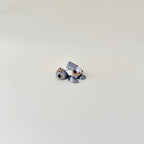 Compact 5 cm articulated turtle in metallic silver with textured cookie back; calming handheld fidget.
