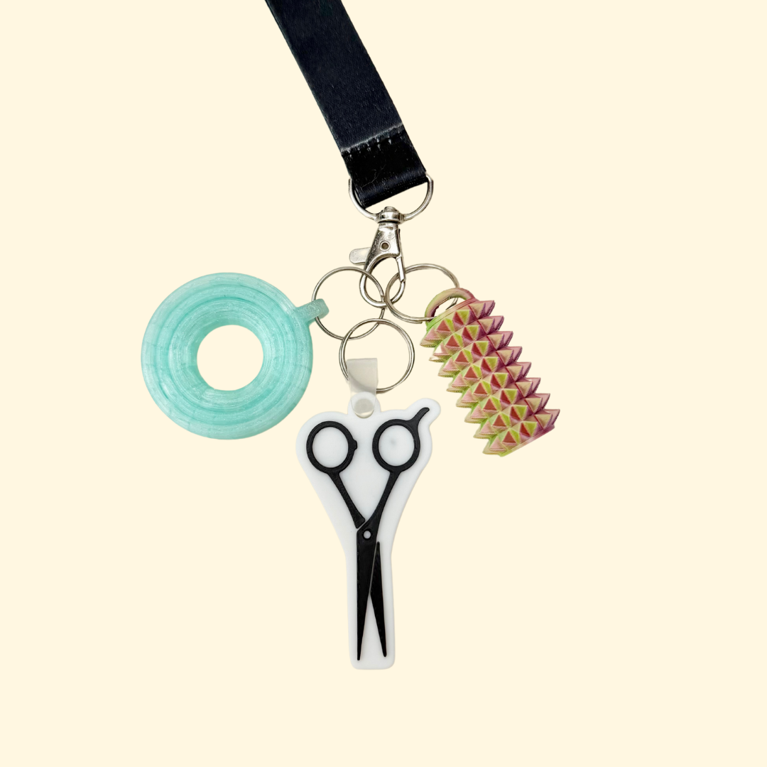 Tap-to-open keyring charm that triggers a chosen call, directions, link, or contact with one phone tap.
