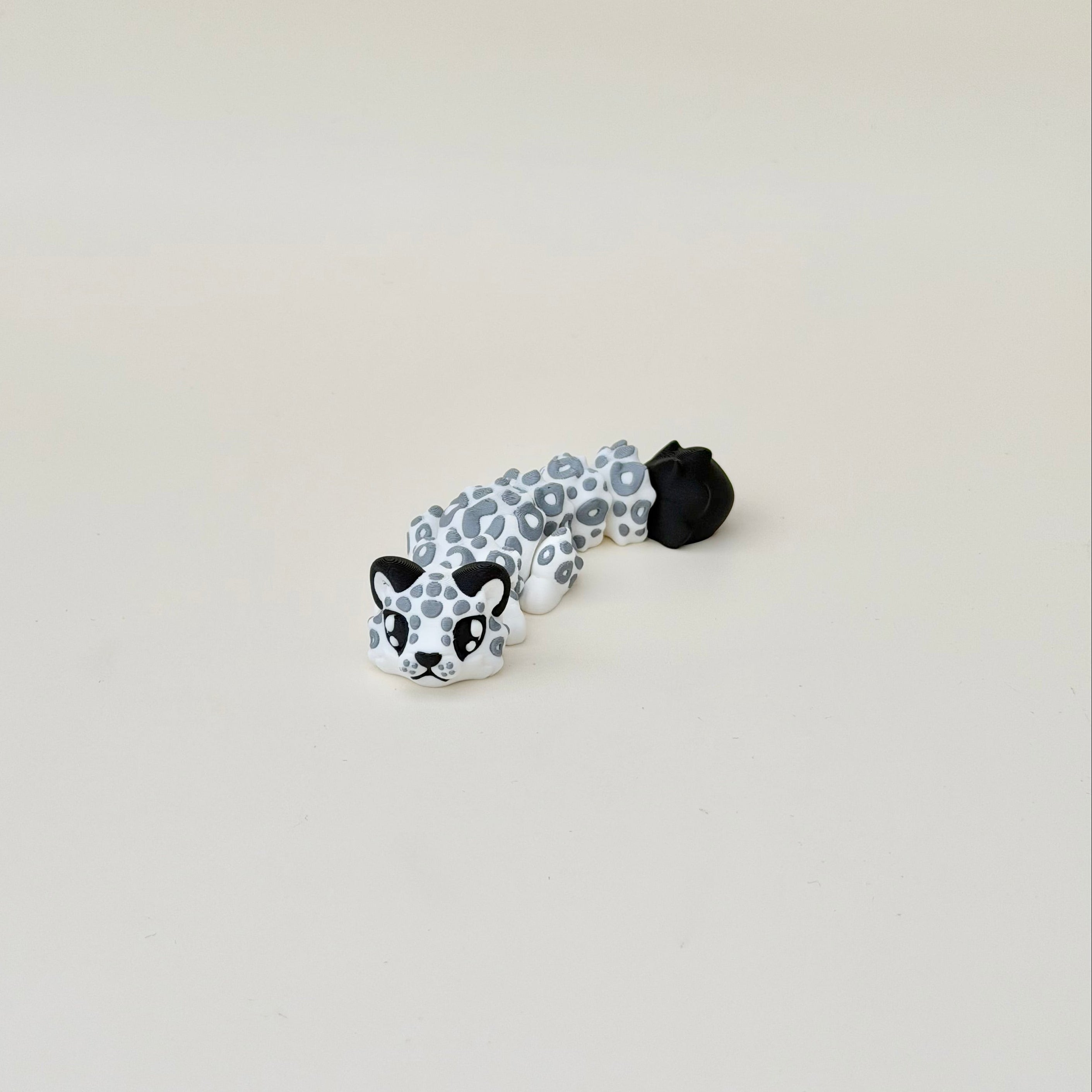 Articulated animal fidget with smooth joint motion and raised detail for repetitive hand movement and neuro-friendly regulation.
