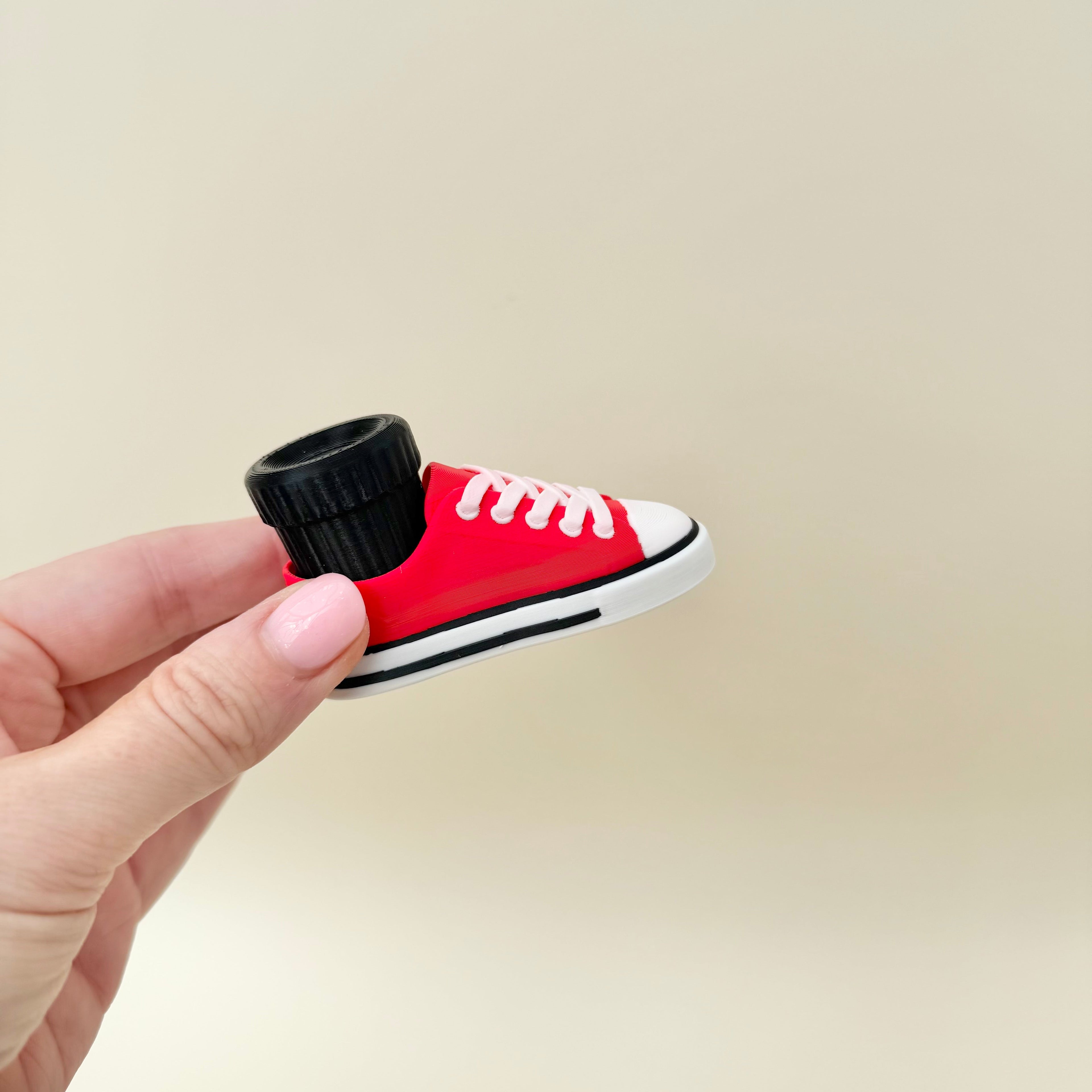 Compact trainer clicker fidget suitable for everyday carry and one-handed use.
