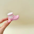 Shoe-themed clicker fidget with movable sock piece for repeated pressing, playful sensory input, lightweight and portable.
