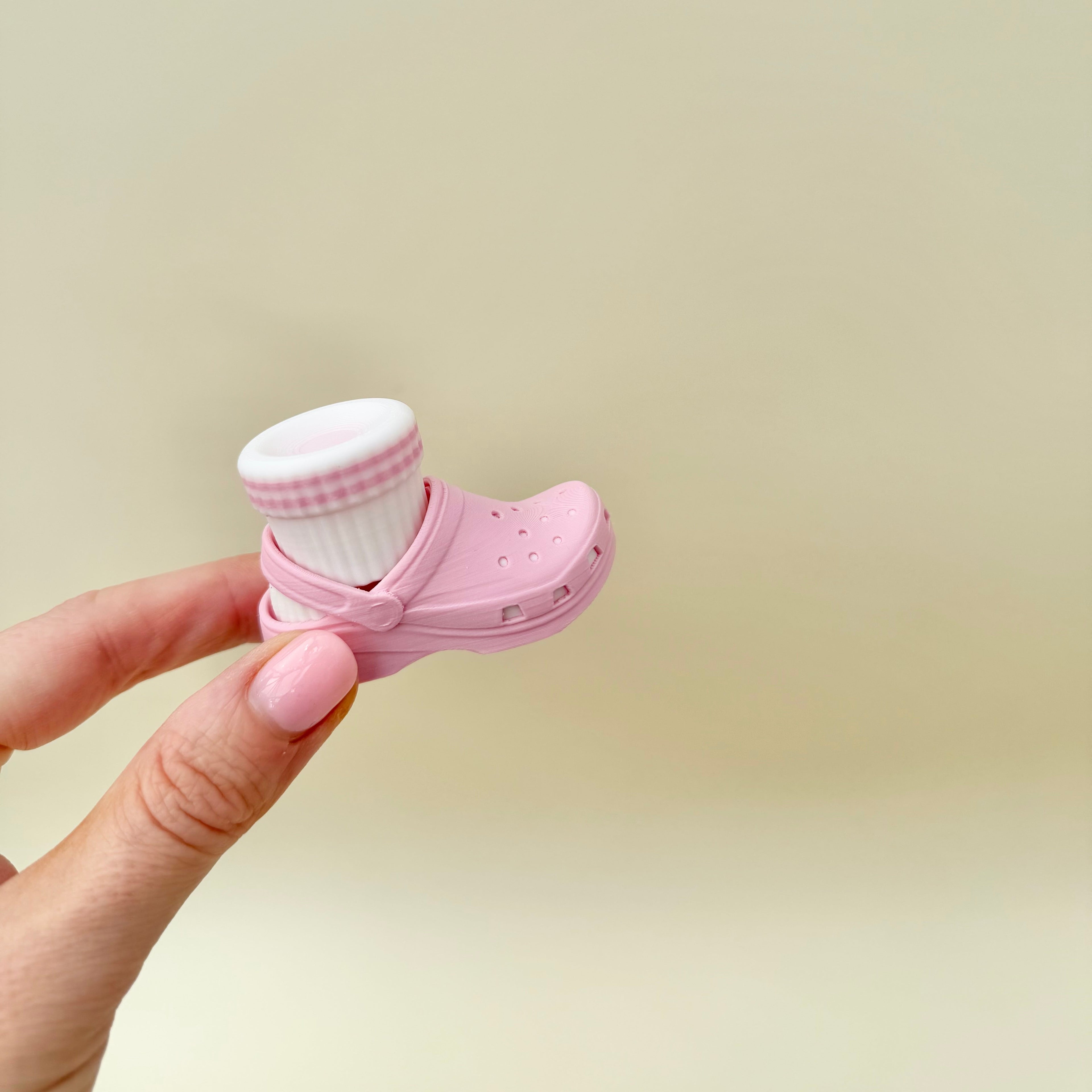 Shoe-themed clicker fidget with movable sock piece for repeated pressing, playful sensory input, lightweight and portable.
