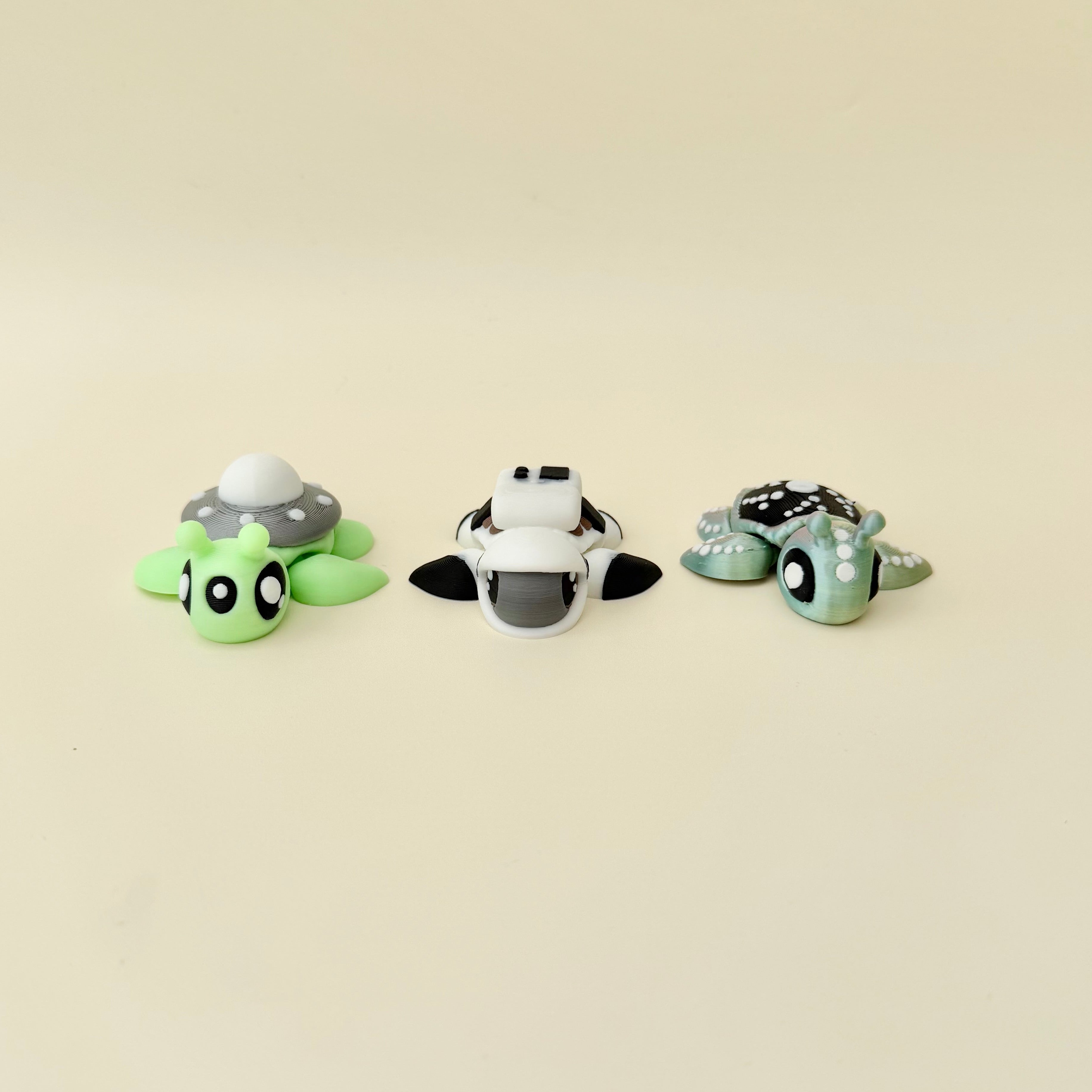 Mini articulated turtle fidgets with themed details for tactile play and collecting