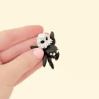 pocket-sized halloween spider fidget toy with skull accent designed for tactile stimming
