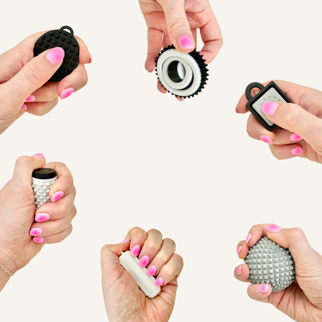 Six-piece pressure fidget set with spiky textures, roller, clicker and palm tools for firm sensory feedback.