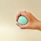 Firm textured sensory ball for deep pressure input, silent grounding and controlled tactile feedback in the palm.
