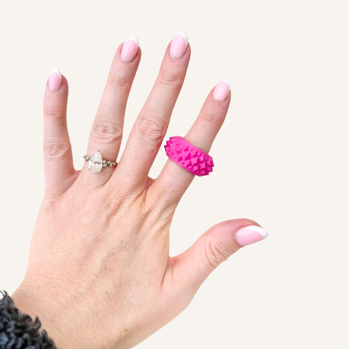 Small Spikz ring worn on the finger for discreet high input sensory fidgeting.