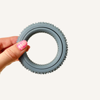 Rotating sensory ring with Spikz texture for adjustable pressure input and tactile fidgeting.