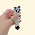 Jointed snow leopard sensory toy around 11 cm long, made for satisfying wiggles, fidgeting and desk-to-sofa company.

