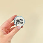 Portable sensory clicker for educators, available in blue, mint, and lilac bases with bold, uplifting words