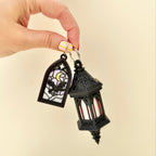 Mini gothic charm fidget with tactile detail and click action for subtle sensory support on the go.
