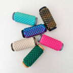 Firm pressure roller used for anxiety grounding, skin picking redirection and tactile input.
