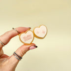Personalised heart clicker fidget with interchangeable words/icons, satisfying click feedback, pocket-friendly keyring.
