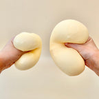 Gel-filled cheese squish toy with a slightly tacky feel for a super grippy, satisfying squeeze