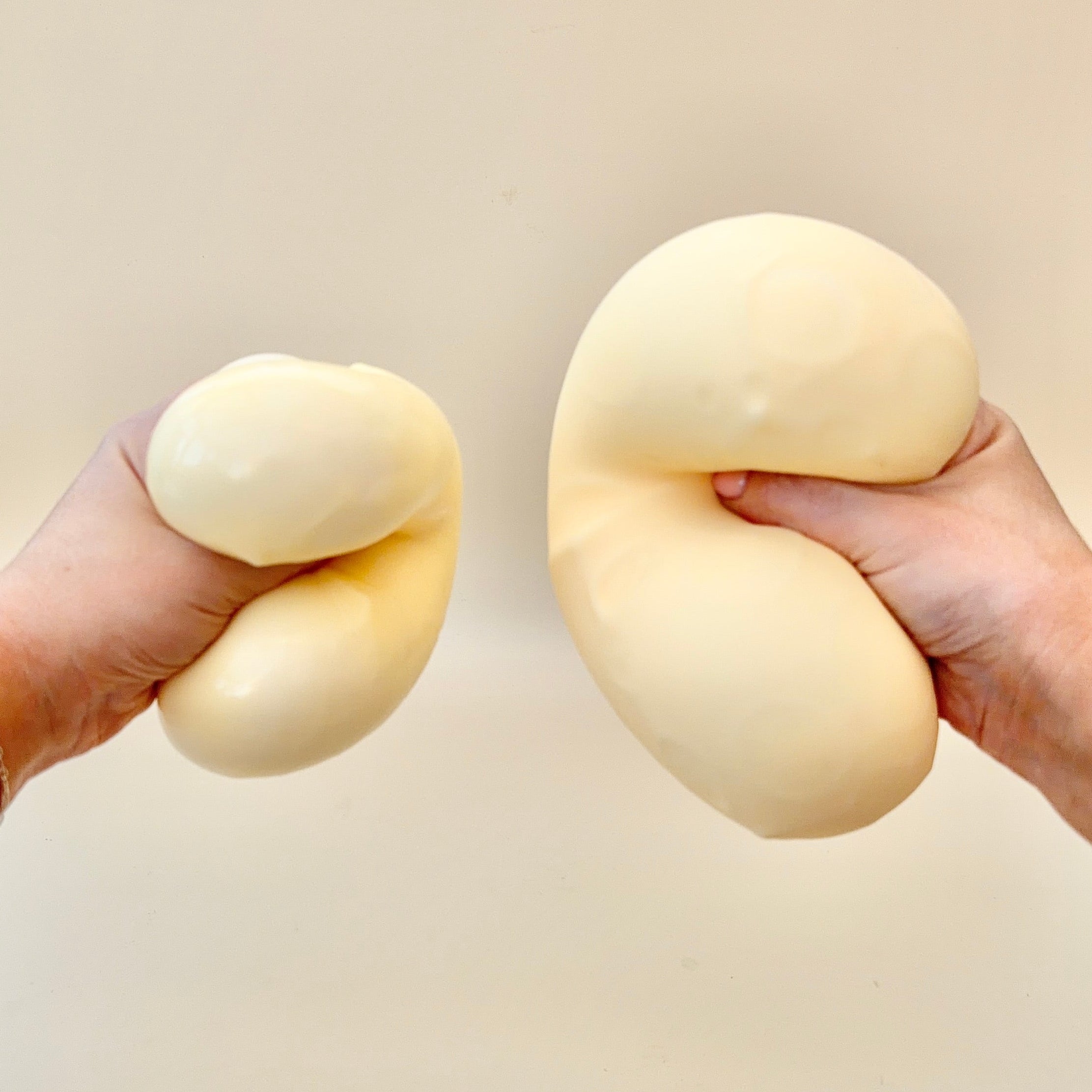 Gel-filled cheese squish toy with a slightly tacky feel for a super grippy, satisfying squeeze