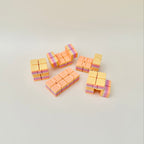 Small textured sensory fidget with clicky folds and smooth movement that loosens with use.
