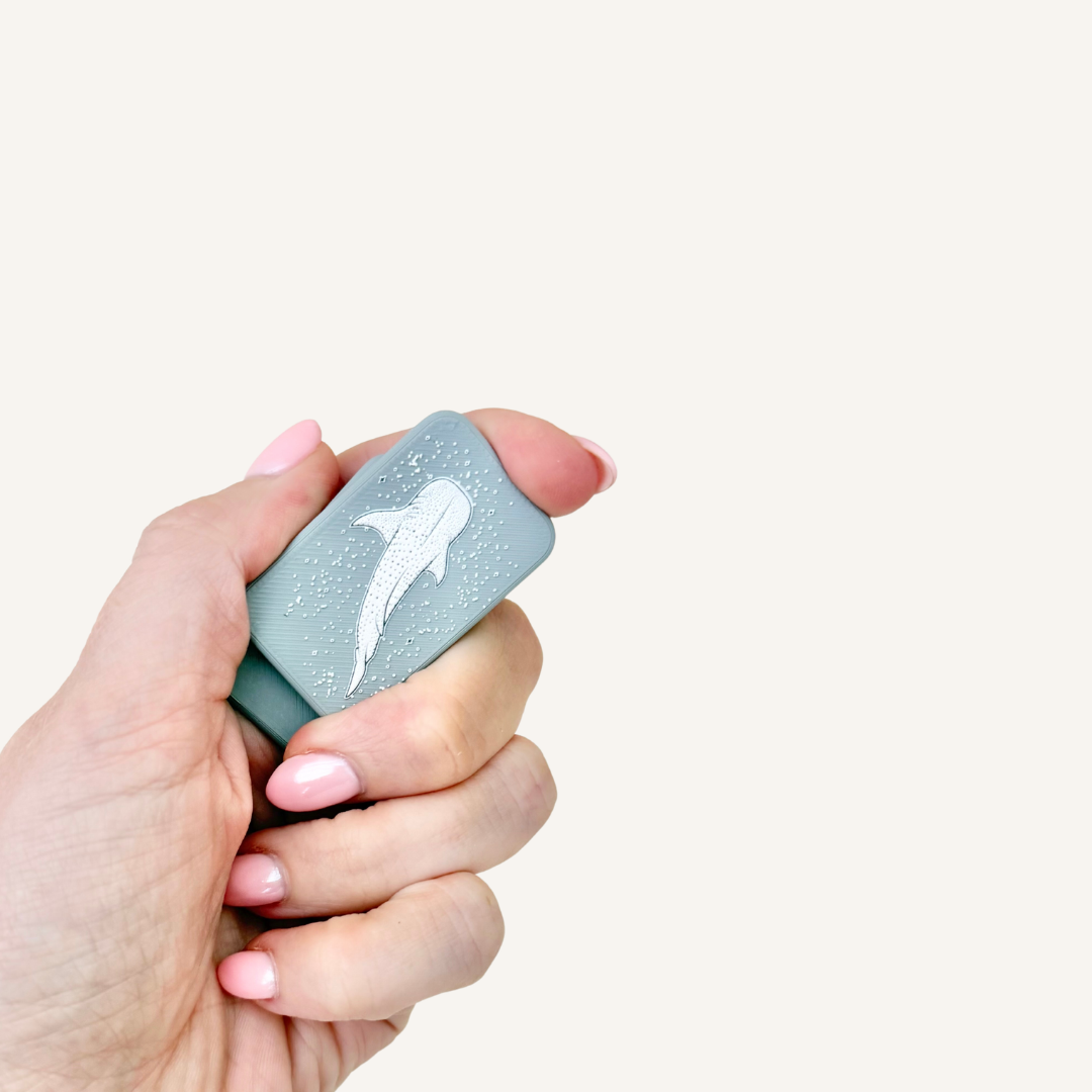Grey pocket magnets with slightly raised glossy whale shark details for additional tactile feedback.