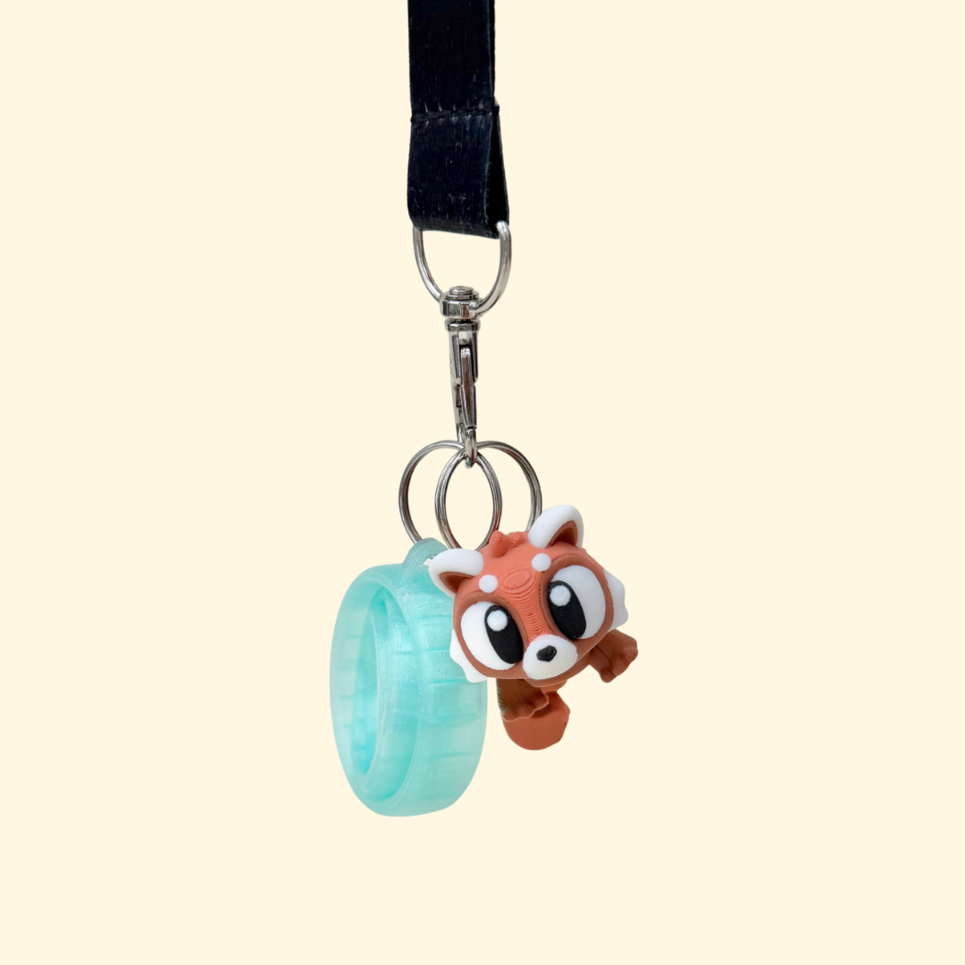 Articulated red panda charm with moving tail and body, textured for tracing, approx 8cm, lanyard or keyring add-on.
