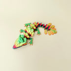 dragon-shaped sensory figure featuring layered feather-like scales and smooth movement for tactile regulation

