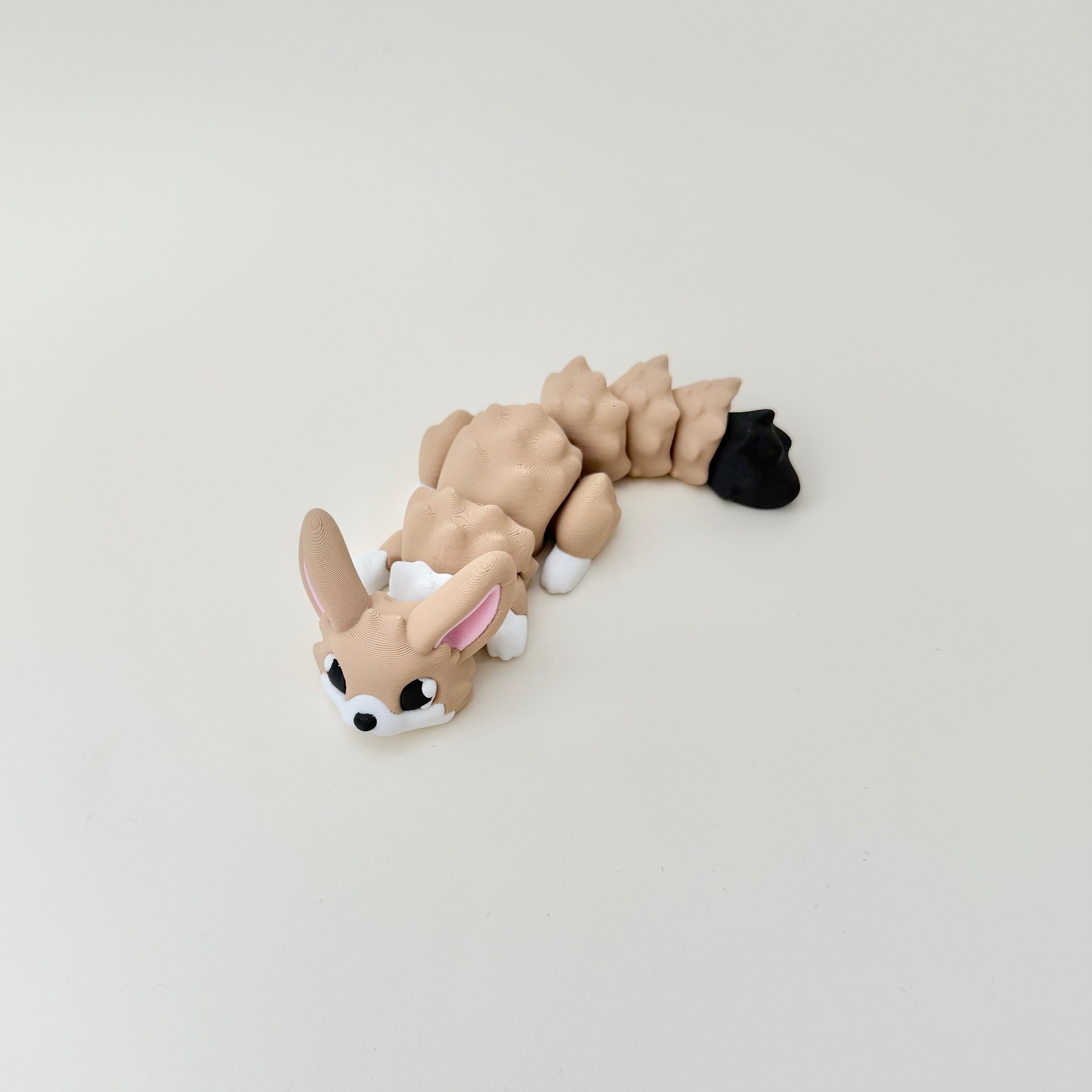 A handheld fox figure with raised details that support grounding and tactile exploration.
