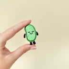 Green fidget toy with raised details and keychain loop, designed for tactile and click-based stimming.