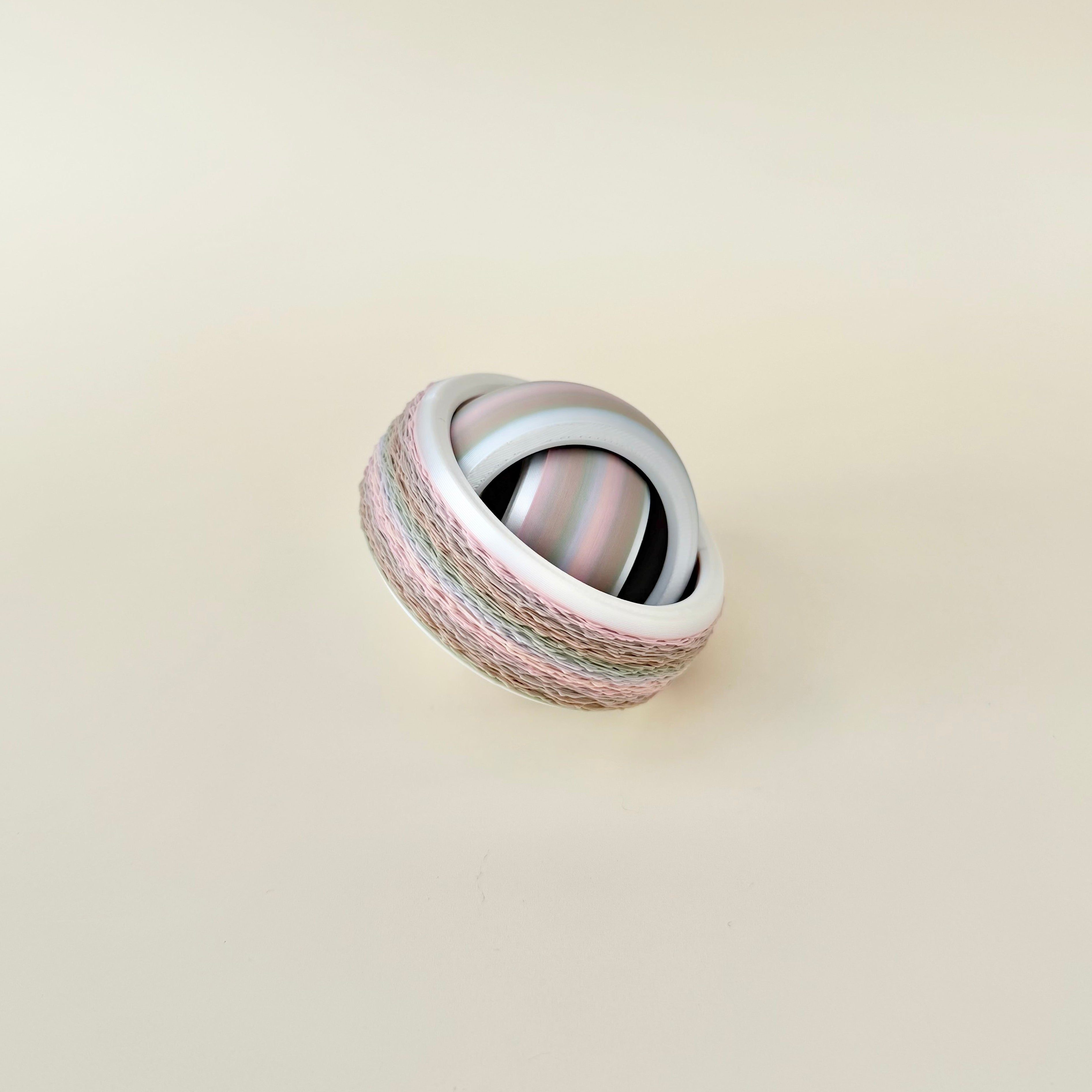Tactile spin fidget with micro-texture edge and smooth inner rings for steady, satisfying hand movement.
