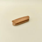 Compact one-hand magnet fidget with wood-style surface for repetitive movement and slightly higher sensory feedback.
