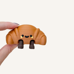 Small smiley baguette collectable made for neuro-friendly workspaces, cosy corners and everyday display
