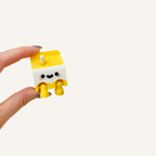 Small smiley carton collectable made for neuro-friendly workspaces, cosy corners and everyday display
