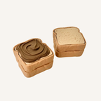 Toast-shaped clicker fidget with a smooth press action, available in plain toast or choco spread style for everyday sensory use.
