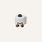 Cute mini toilet roll character with dangling legs designed for desks, shelves and funny feel-good decor spaces
