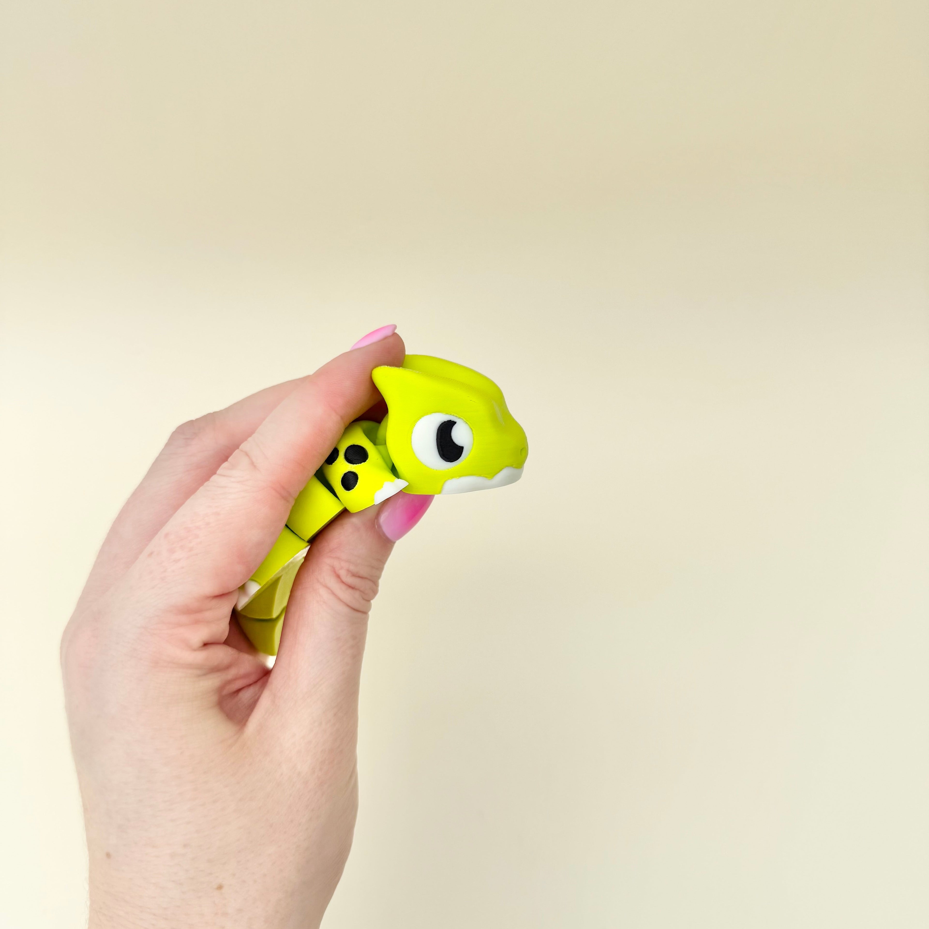 Portable dragon fidget with flexible movement and smooth finish for bags, desks and sensory kits.