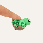 Cute turtle sensory clicker with moving legs, wrist strap and tactile details for busy hands.